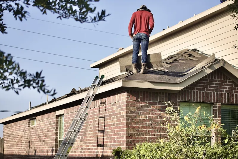 Professional roofer working on a residential roof in North Indian Trail